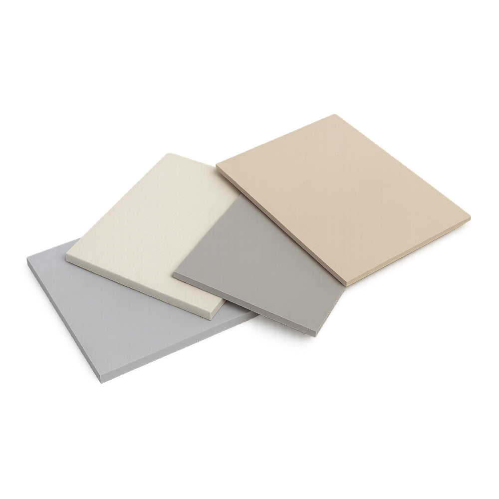 Stacked high temperature insulation boards including calcium silicate and millboard in industrial setting with furnaces in background