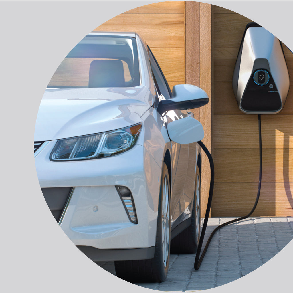Electric vehicle parked at a charging station, illustrating a typical use case for EV fire blankets in high-risk environments.
