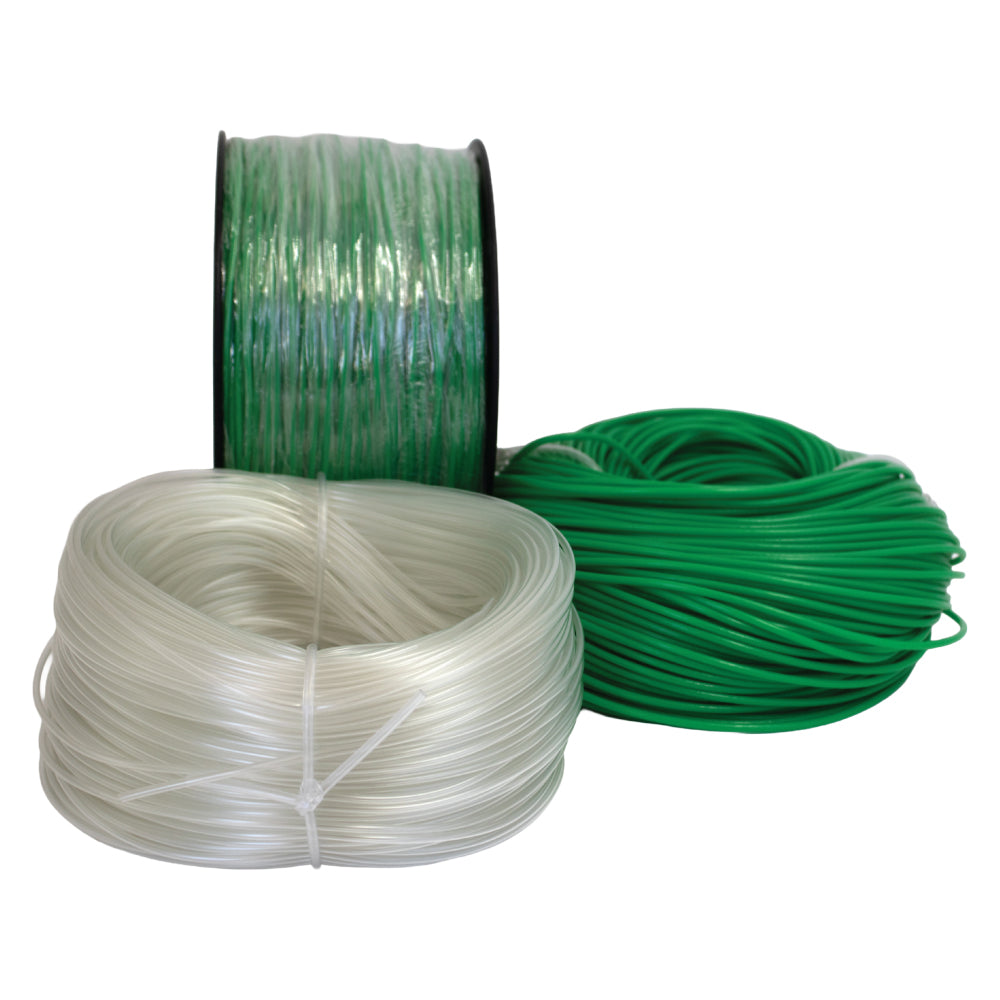 green and clear pvc tubing rolls in various diameters for electrical insulation displayed on light grey 
