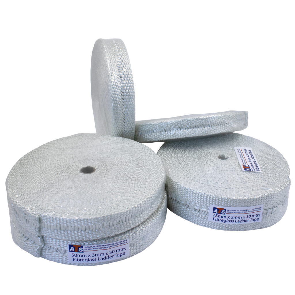 Multiple rolls of plain woven fibreglass ladder tape with open centres, stacked and arranged on a pale grey surface, designed for high-temperature insulation applications.