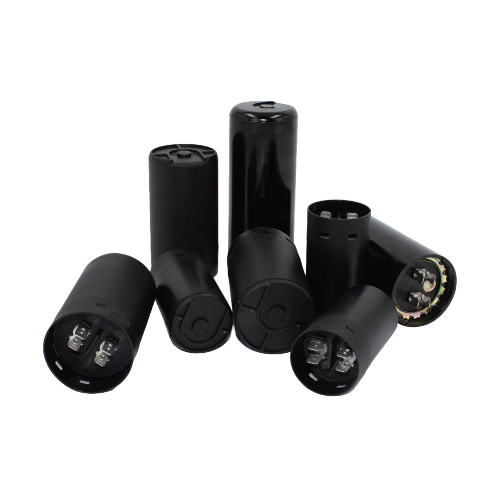 Assorted 125V motor start capacitors in black cylindrical housings with terminal connectors, designed for reliable electric motor starting in industrial and commercial applications — ideal for HVAC systems, compressors, and pump motors.
