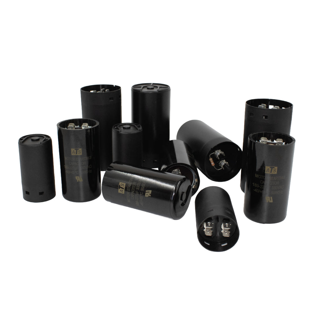 Assorted 330V motor start capacitors in black cylindrical casings, shown upright and on their sides, illustrating various capacitance and size options for industrial and commercial motor applications.