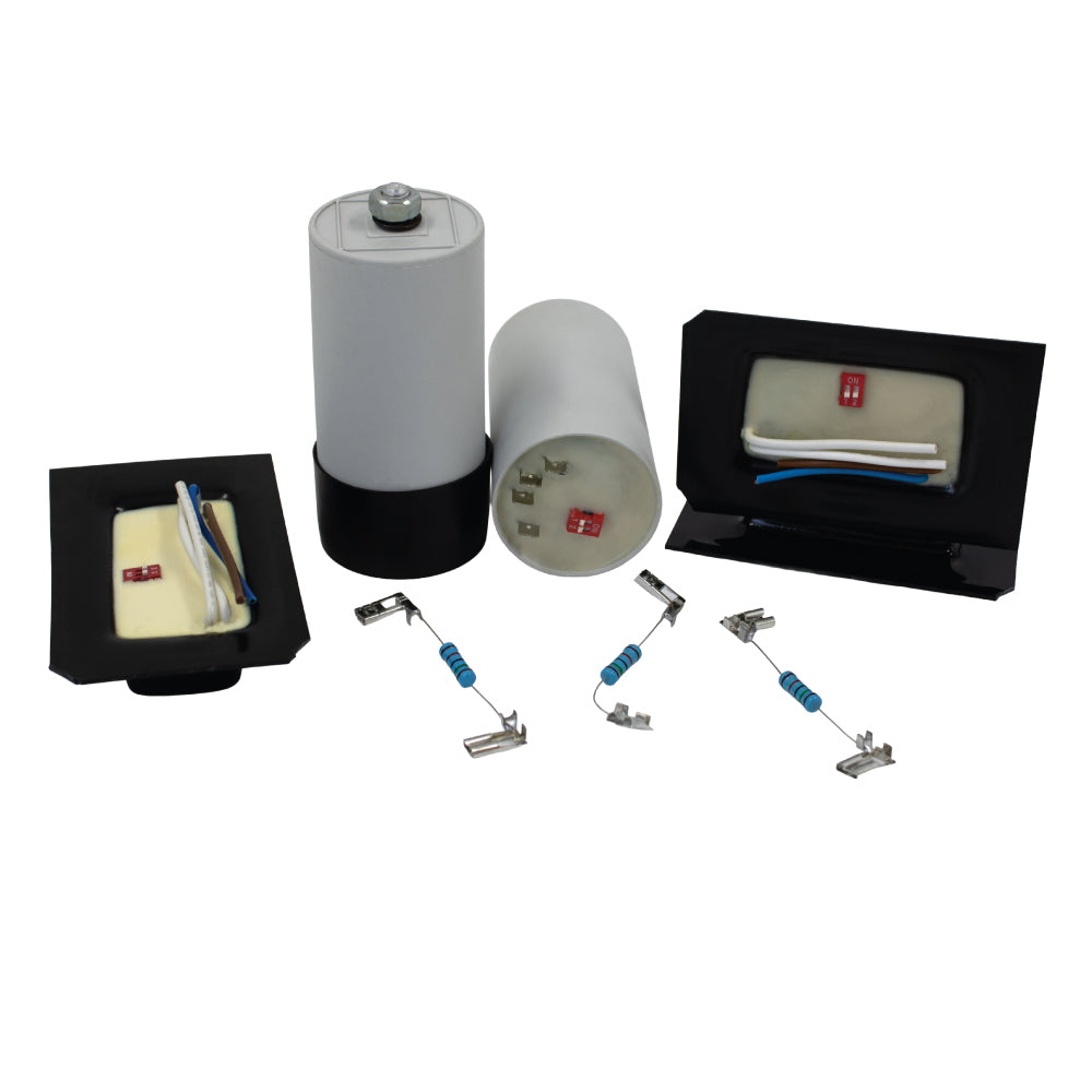 Assorted electronic motor start switches and capacitors arranged on a white background, showcasing components used for reliable and efficient motor start-up in industrial and commercial systems.