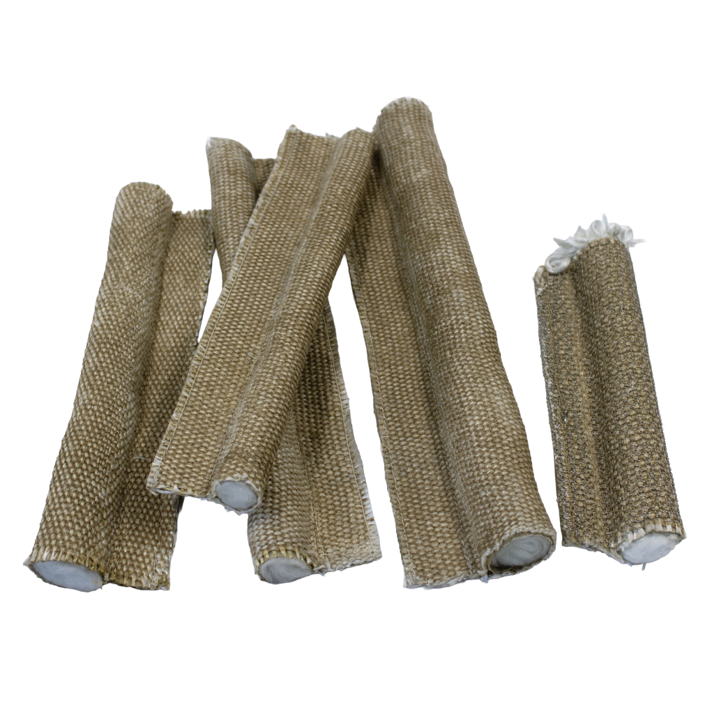 Several pieces of fibreglass 550°C tadpole tape (P seal) with soft bulb cores, arranged on a pale surface. Designed for high-temperature sealing applications such as oven and inspection doors.