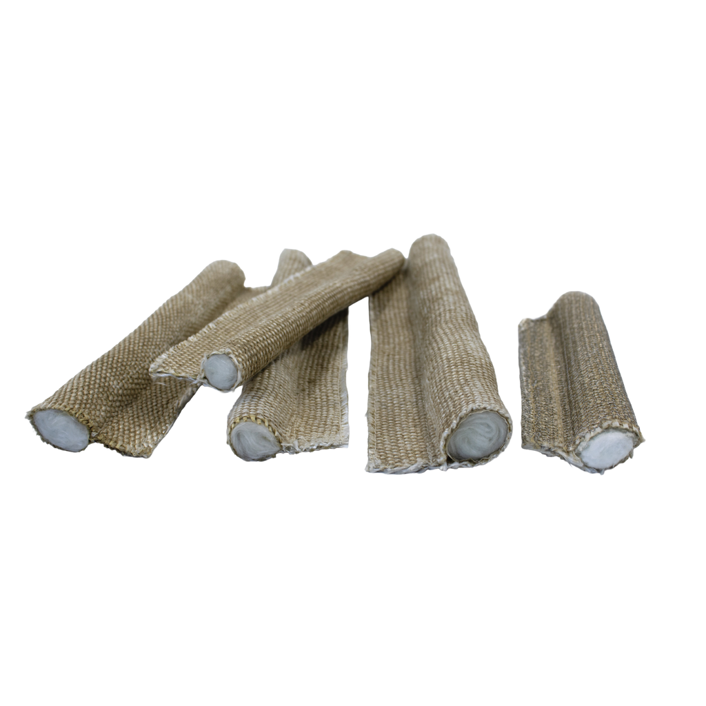 Several pieces of fibreglass 550°C tadpole tape (P seal) with soft bulb cores, arranged on a pale surface. Designed for high-temperature sealing applications such as oven and inspection doors.